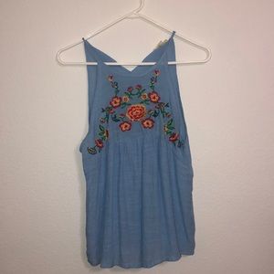 Blue no sleeve blouse with flowers